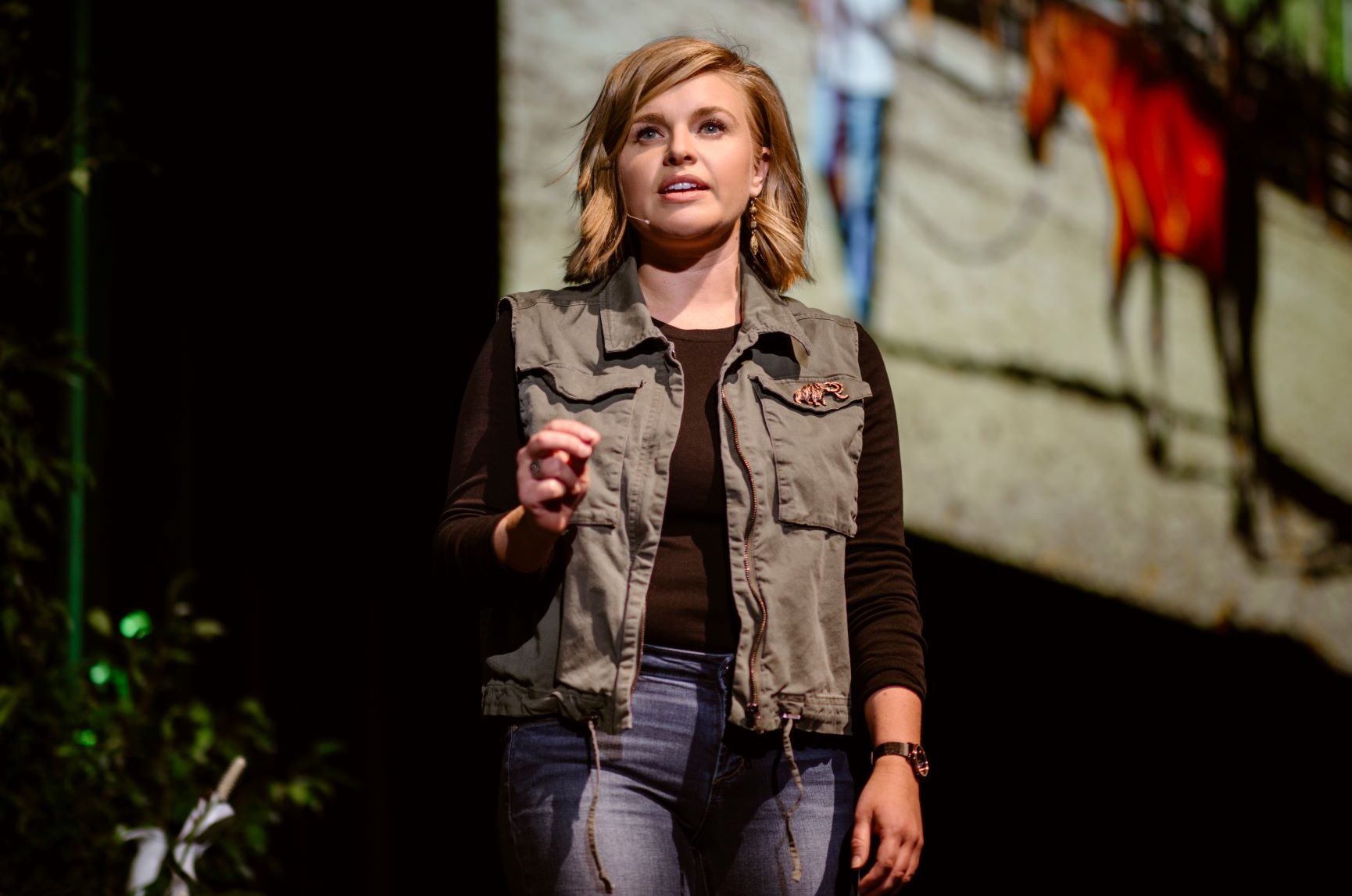 A young lady pitch at Techstars Demo day