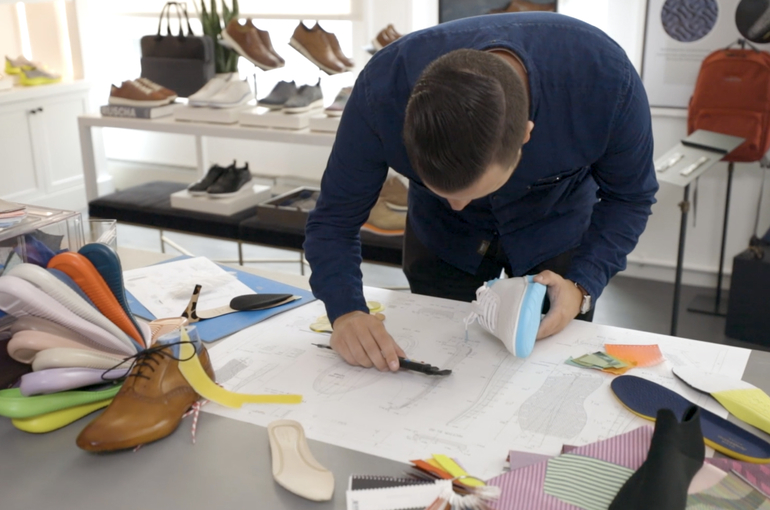 Cole Haan designer work on drawing