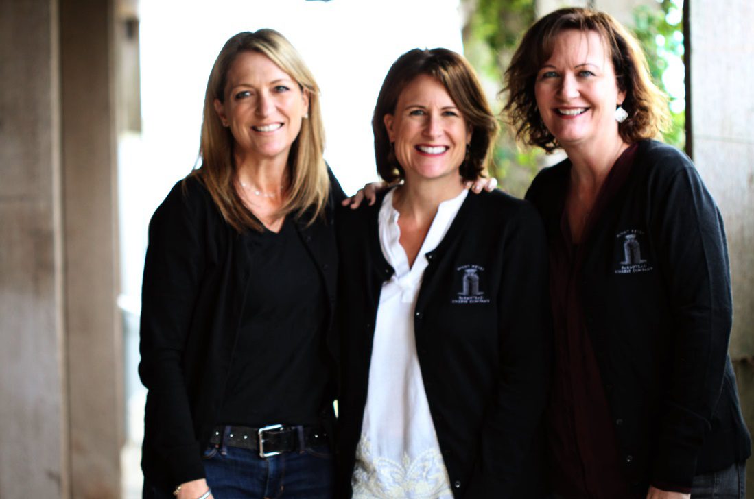 Business owners in front of the office