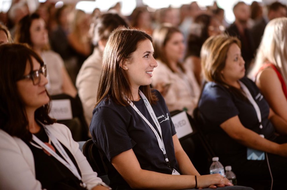 People watch entrepreneurs pitching at the denver startup week