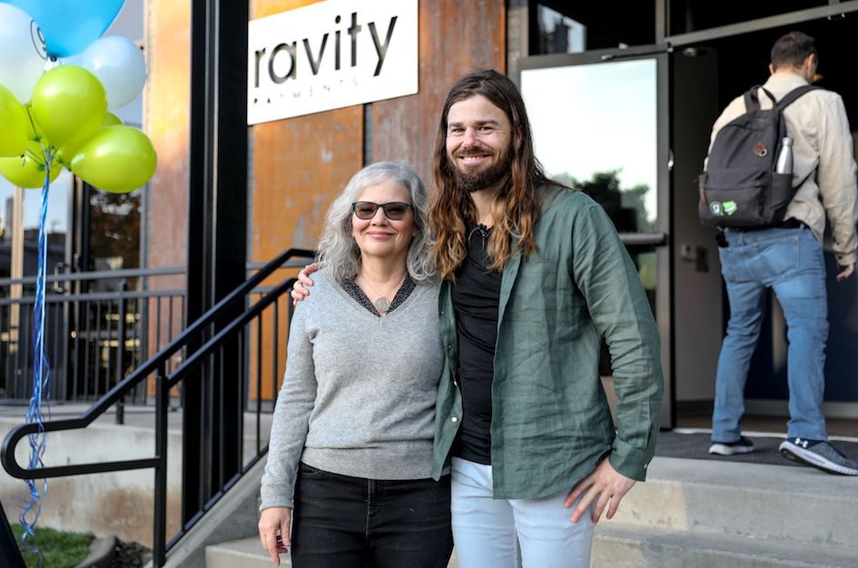 Dan Price in front of his headquarters