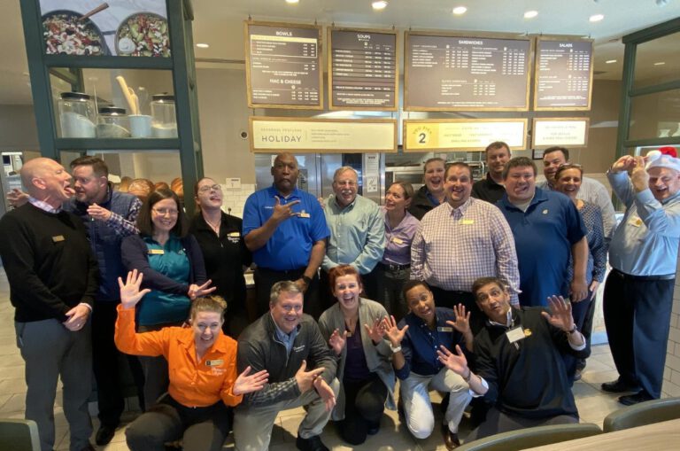 Panera Bread team celebrate in a holiday event