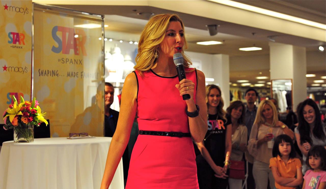 Sara Blakely talks in a department store in a mall