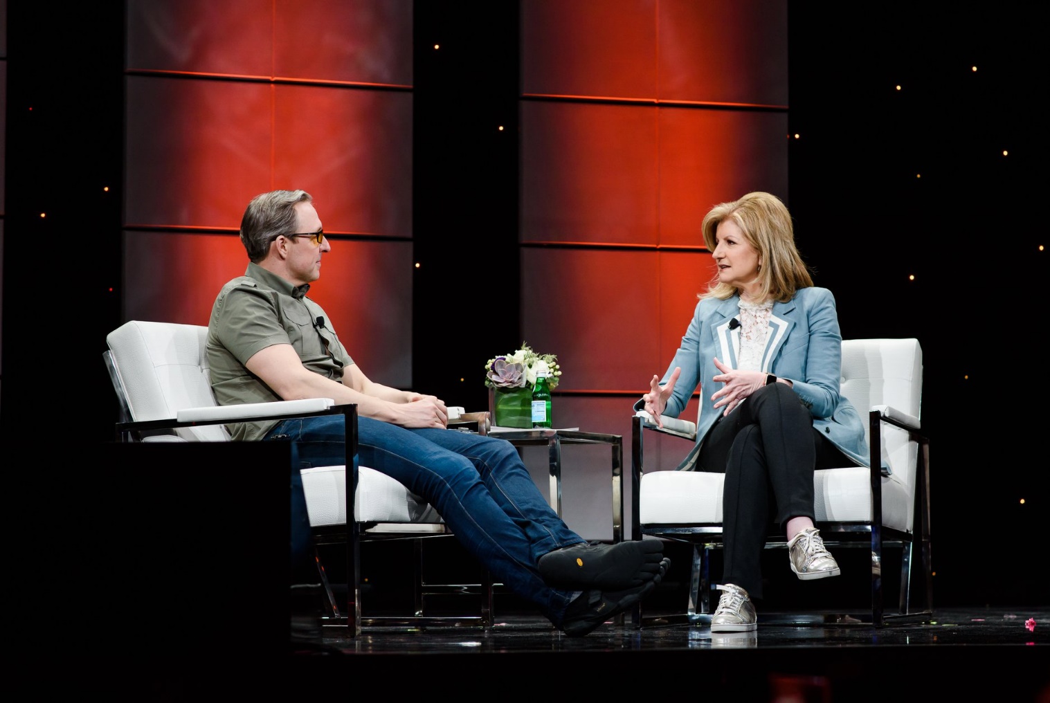 Arianna Huffington in an interview with guest on stage