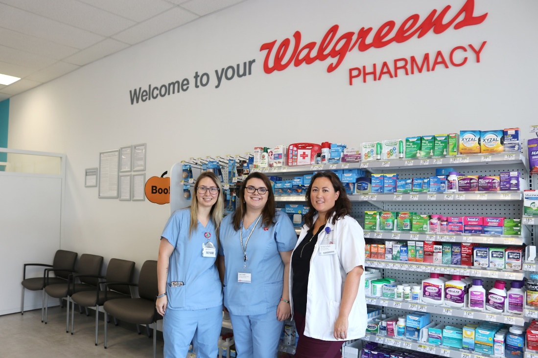 Walgreens staff and pharmacy staff collaborate