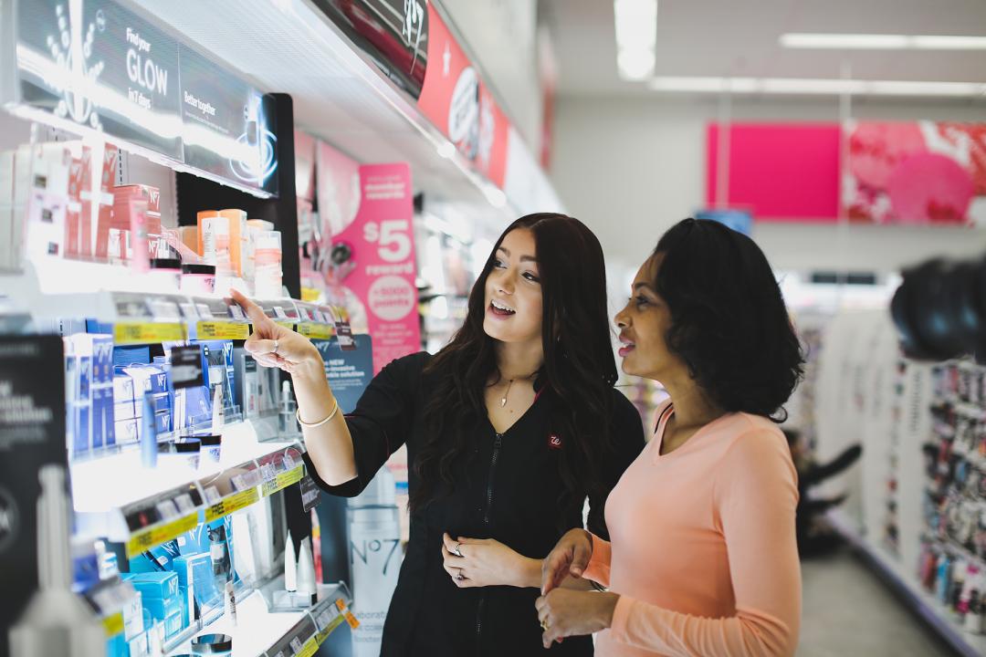 Walgreens consumers shop at a local store with staff assistance