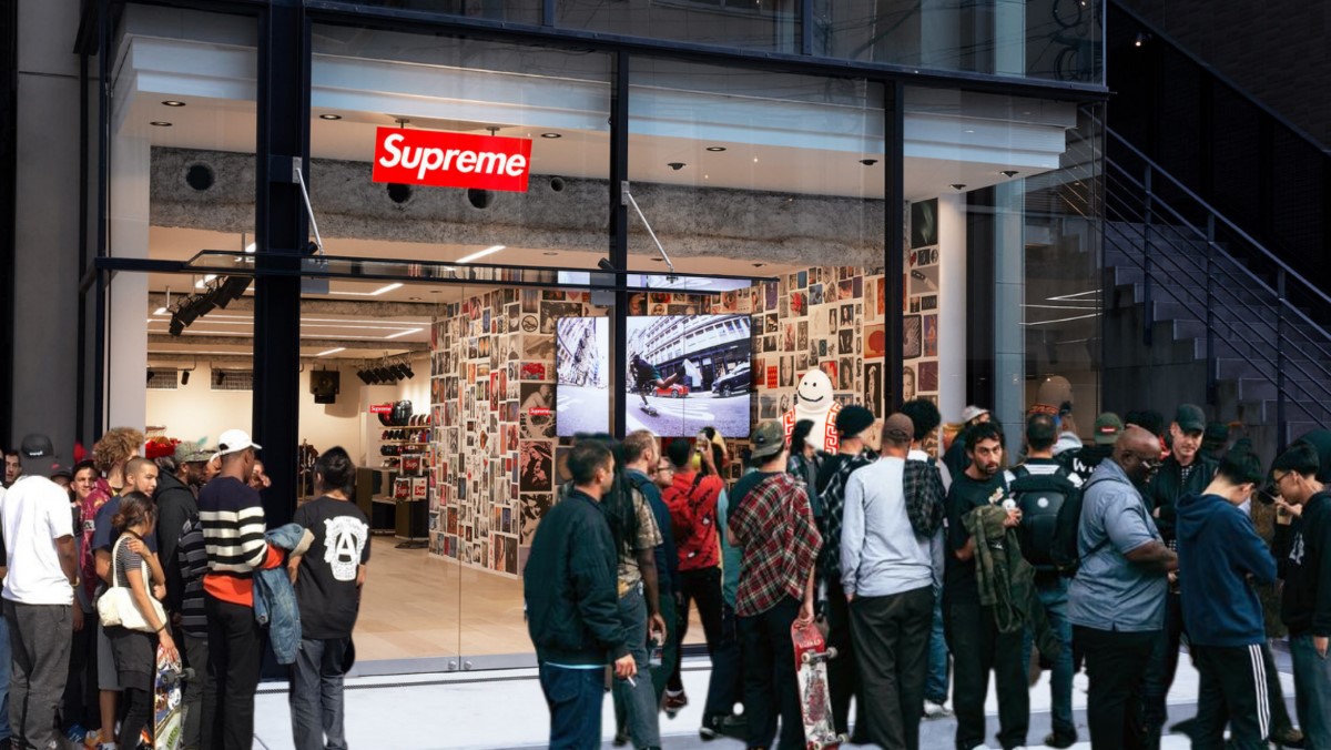 Supreme customers stand in line in front of a store