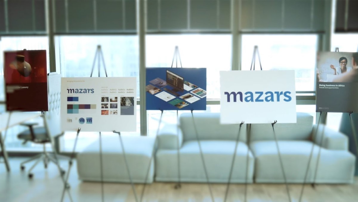 Mazars leadership team review the new identity design