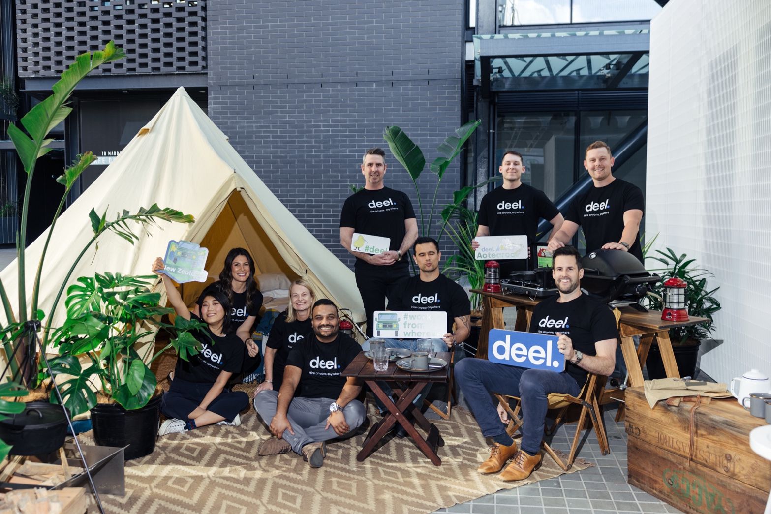 Deel staff celebrate at an outdoor space