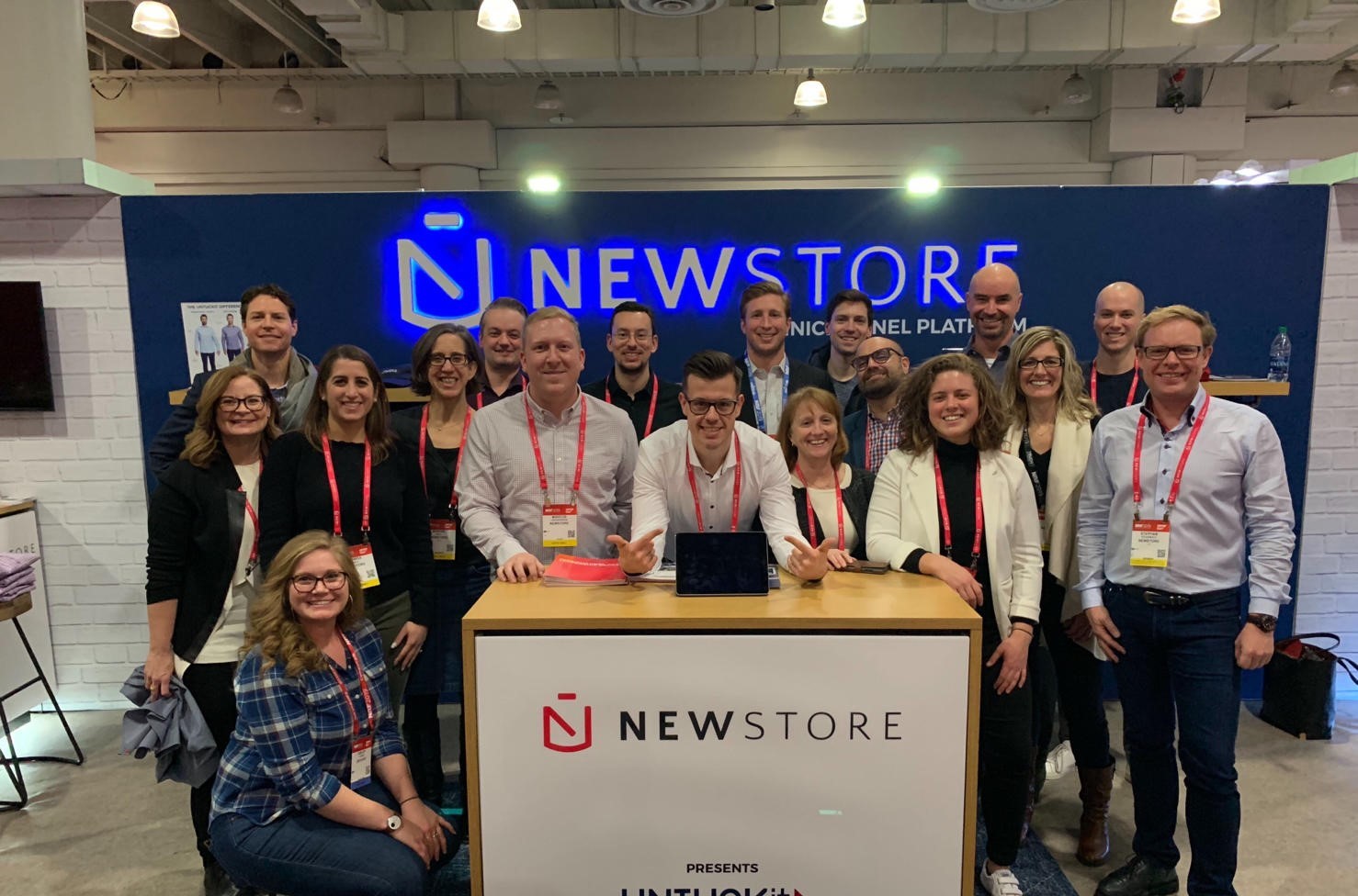 NewStore team presents at their booth in a trade show