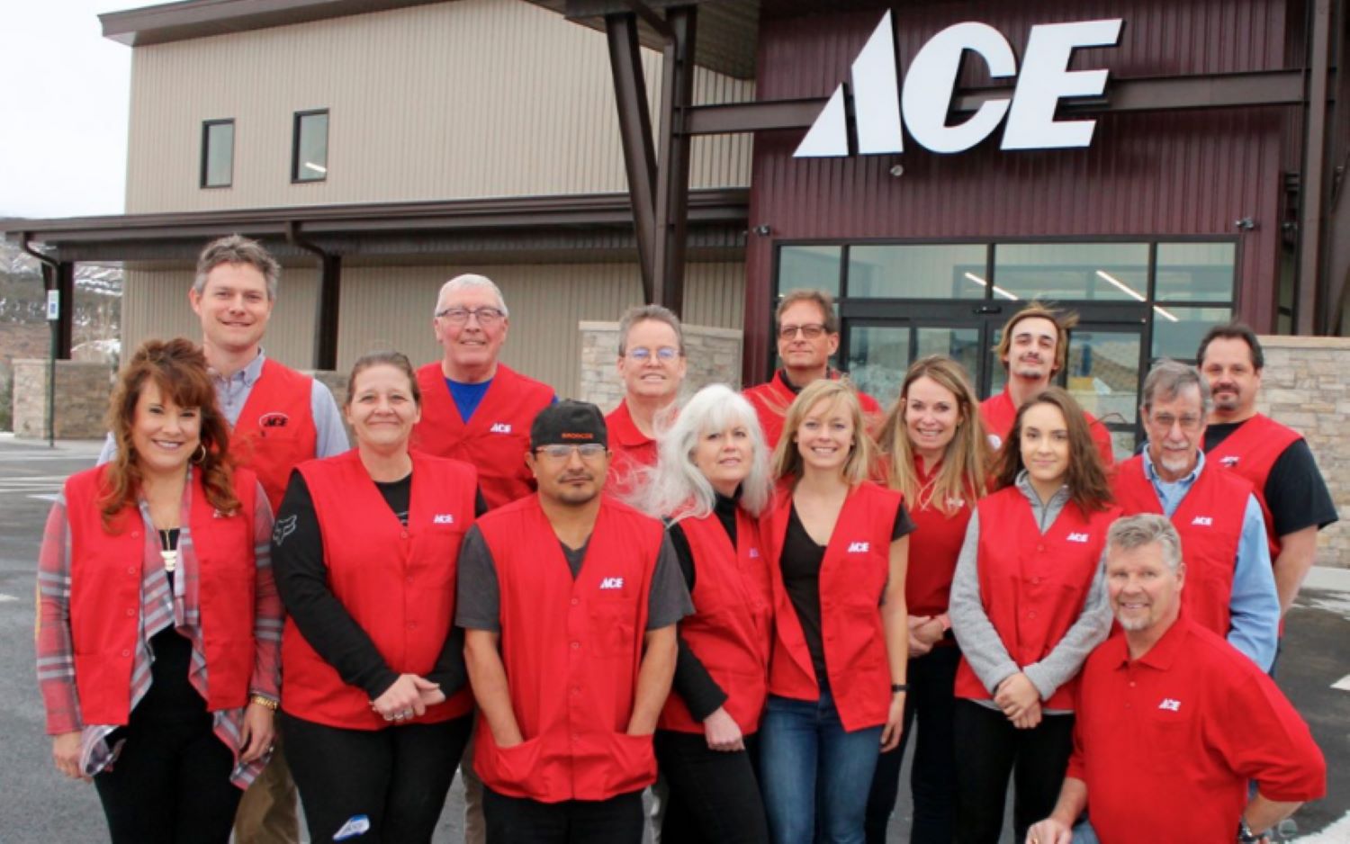 Ace Hardware staff in front of a store