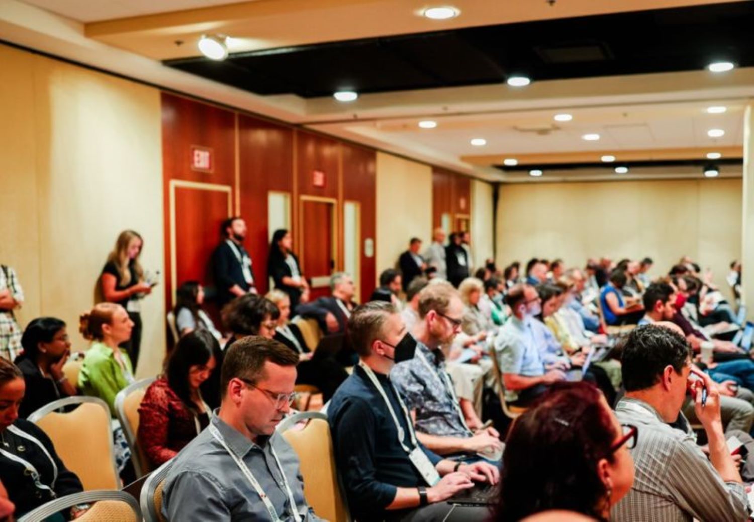 Journalists gather in a conference room