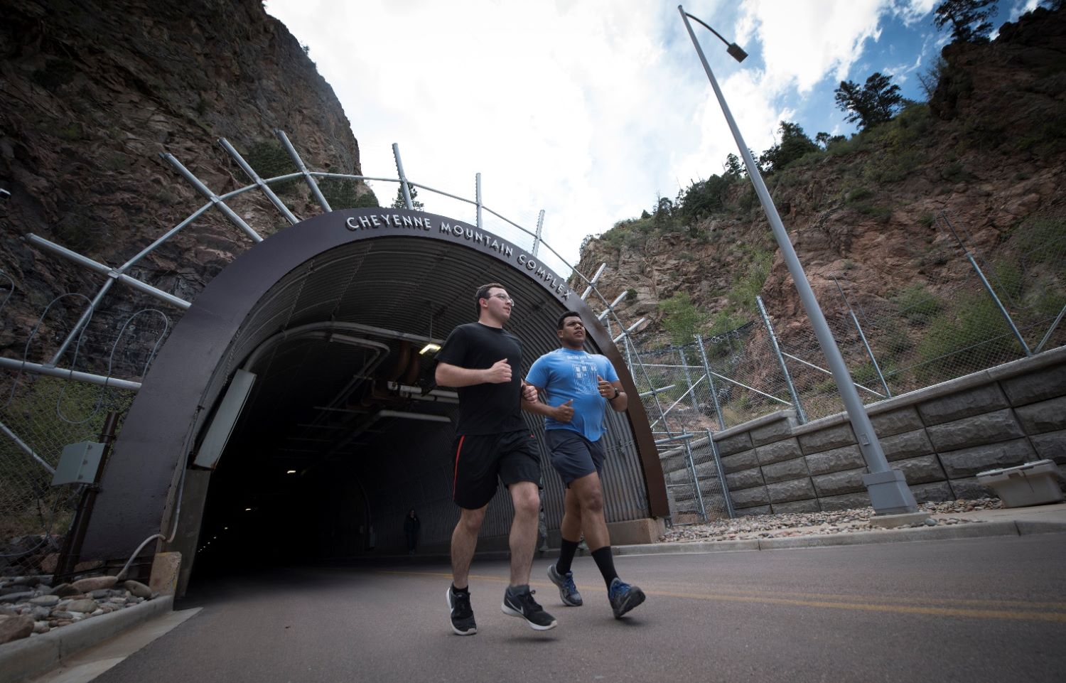 people running passing by the entrance of Cheyenne Mountain Complex