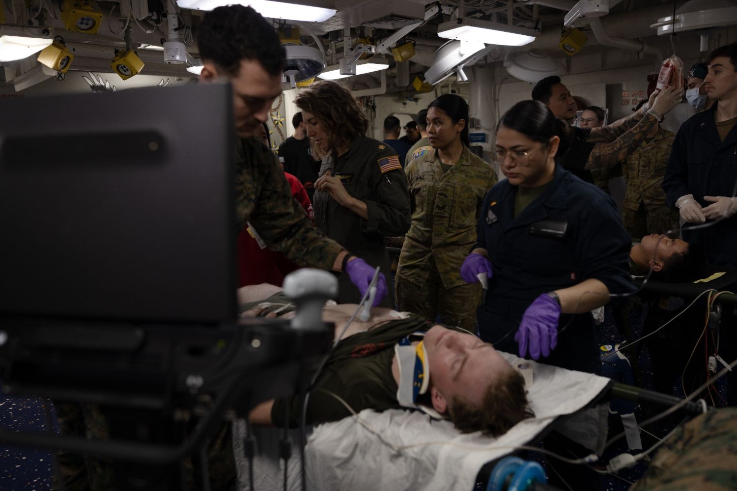 soldiers perform medical procedures